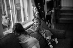 Funny shot of kids looking out a window